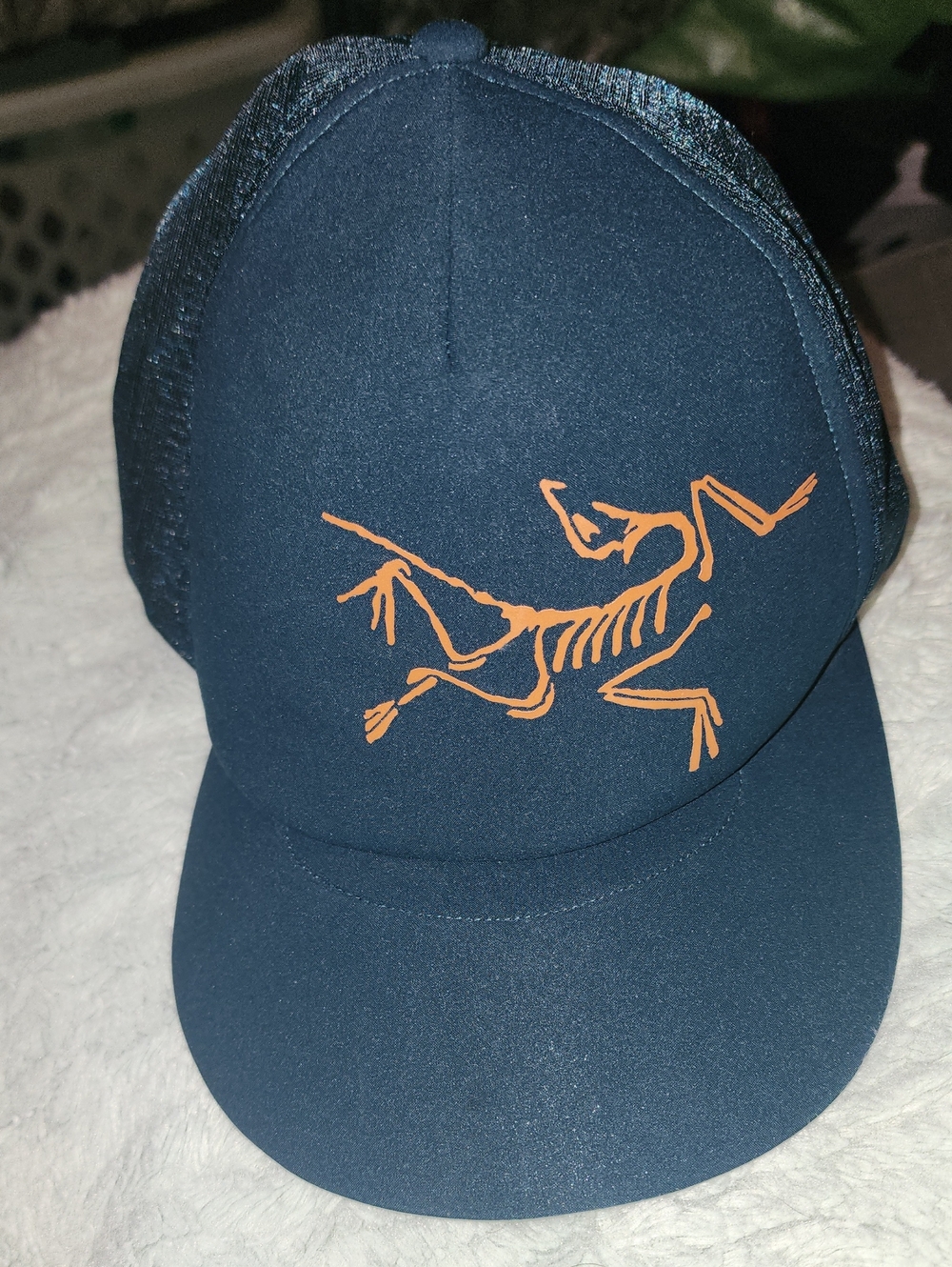 Arc'teryx Navy Trucker Hat with Orange Logo